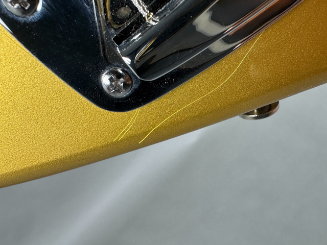 Finish cracks below the tremolo