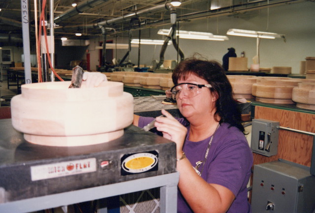 Inspecting snare drum for flatness on a granite block